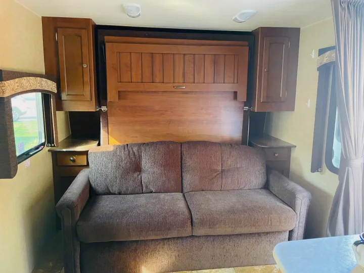 Frame folds down to release Queen bed. Jayco White Hawk Ultra Lite 2014