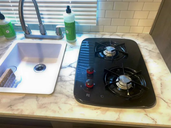 The two burner propane stove gives you the ability to cook inside in any weather.. Other Other 2021