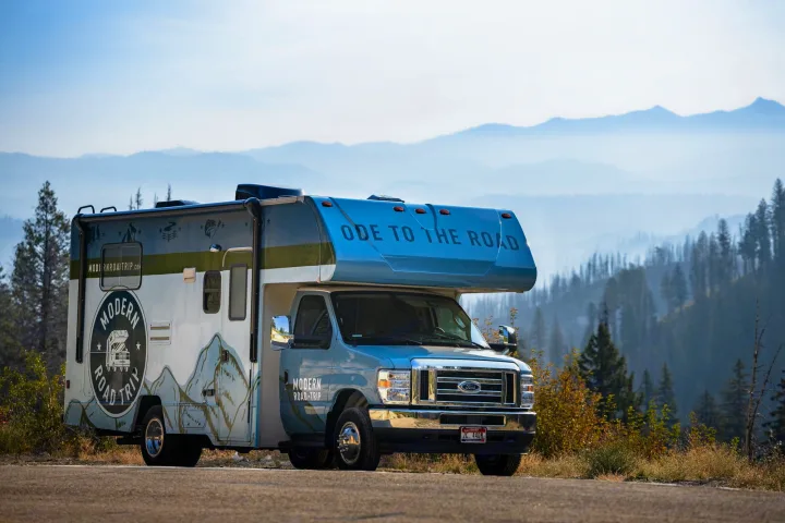 Modern Road Trip RV rental parked on a scenic mountain road, ready for adventure through misty landscapes.. Winnebago Minnie Winnie 2021