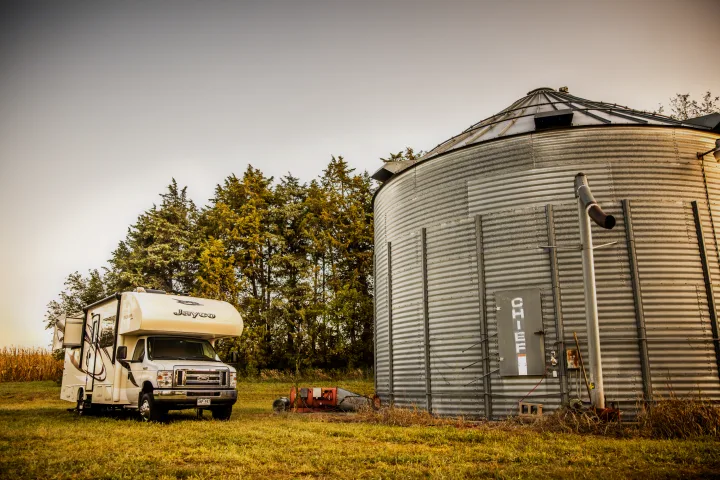RV rental: Jayco motorhome beside a Chief grain silo. Rural farm setting at golden hour.. Jayco Redhawk 2016