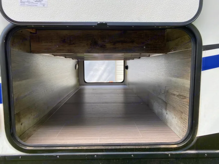 Inside an RV rental's spacious pass-through storage compartment, ready for your adventure gear.. Other Passport 2020