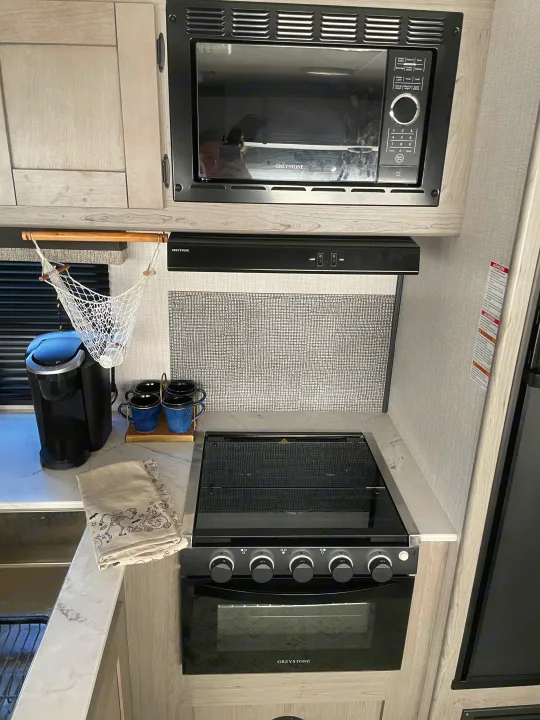 Gas stove and oven with a micro wave on top and all your silverware pots and pans included.. Other Other 2021