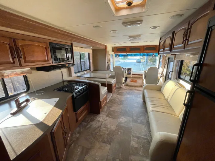 Explore this bright rv rental interior with a well-equipped. Coachmen Mirada 2014