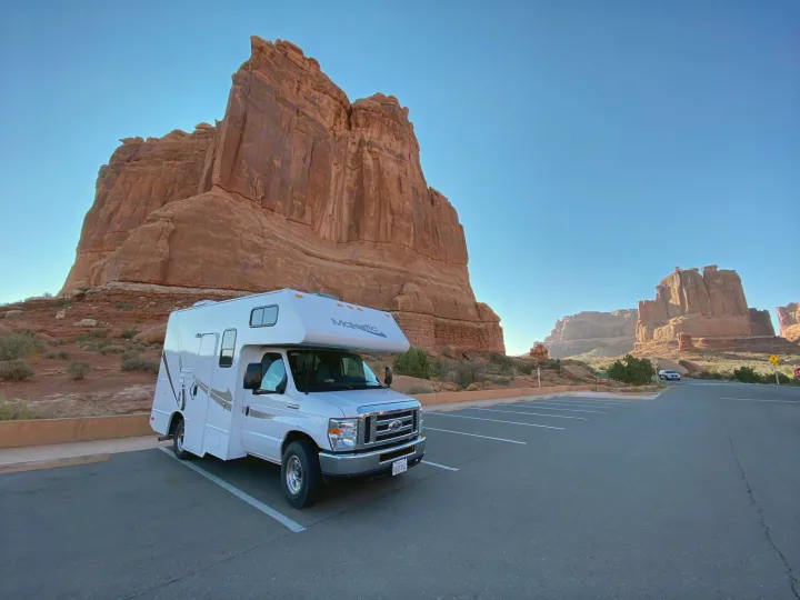 Explore vast landscapes! This **rv rental** is perfectly parked, ready for adventure among towering red rock formations in a national park.. Thor Motor Coach Four Winds Majestic 2017