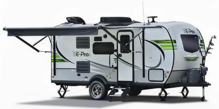 A white Flagstaff E-Pro travel trailer with an open awning & bike rack, perfect for your next rv rental trip.. Forest River Flagstaff 2020