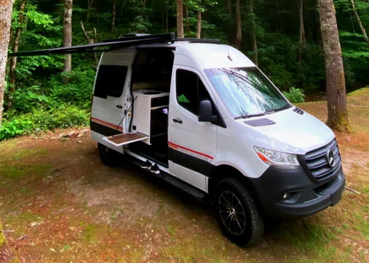 This is the outside of the van set up at a camp site. Other Sprinter 2021