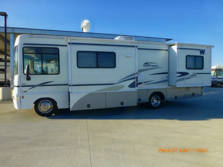 Slide outs view. Push a button took make them go out or come in, very simple & fun to watch.. Winnebago Sightseer 2005