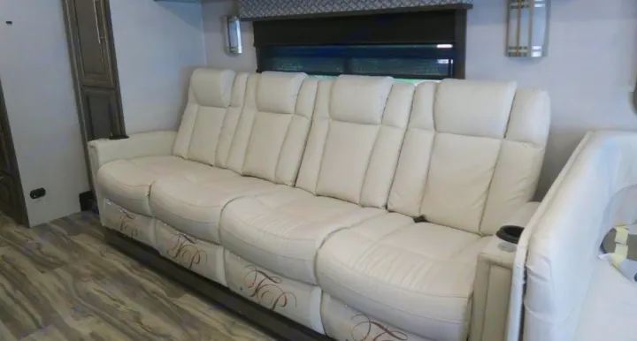 Enjoy comfort on the road in this RV rental with plush, cream-colored theater-style recliner seating.. Forest River Georgetown GT7 2021