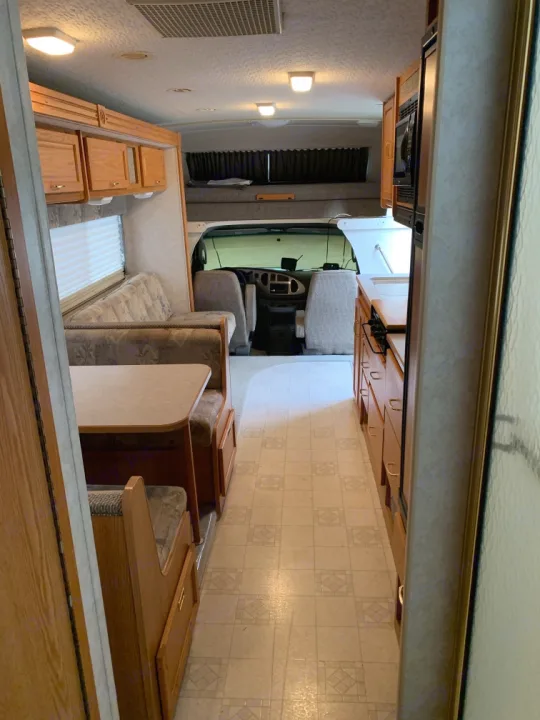 Four person dinette, large couch across from kitchen area. Plenty of room for people to pass back and forth even with the slide not extended out.. Itasca Spirit 2004
