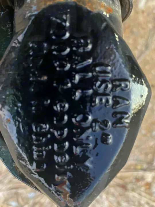 Close-up of a glossy black RAM brand trailer coupler, showing embossed text: 'RAM', 'USE 3291', and 'NO. 4970 N'. Ideal for an RV rental hitch.. Other Other 2020