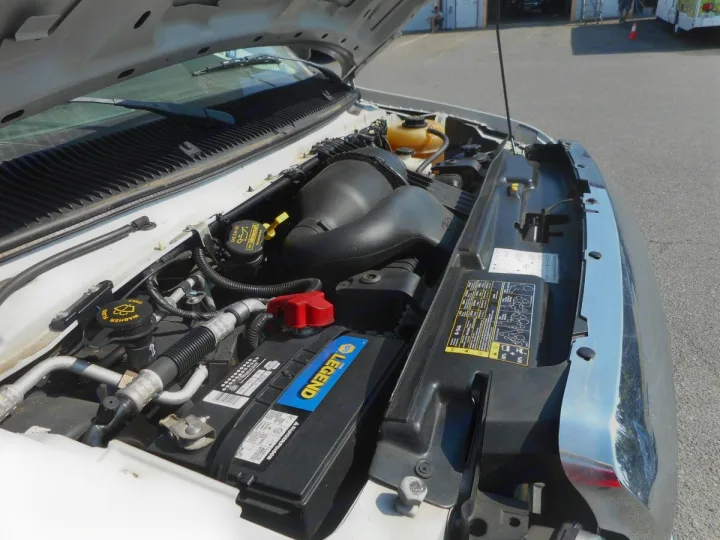 RV rental engine bay open for inspection, showing battery and fluid caps.. Thor Majestic 2017