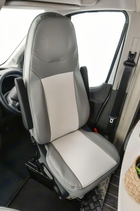 Comfortable driver's seat with armrests in an RV rental. Two-tone gray upholstery, ready for your road trip comfort.. Roller Team 685 Zefiro 2022