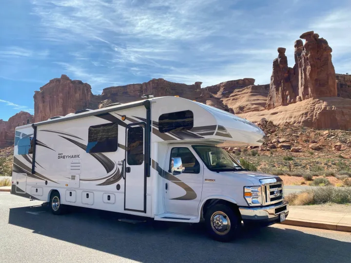 Jayco Greyhawk rv rental ready for adventure, parked among stunning red rock monuments under a blue sky.. Jayco Greyhawk 2019