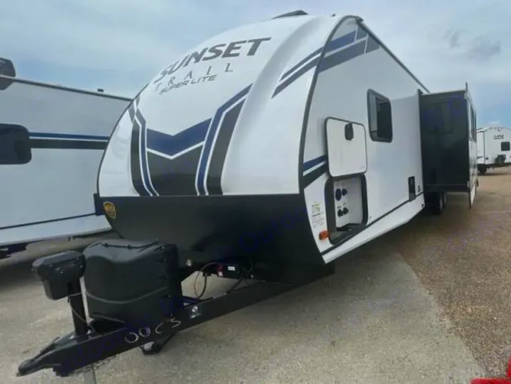 Front-side view of a white "Sunset Trail Super Lite" travel trailer. Explore options for your next RV rental adventure.. Crossroads Sunset Trail Super Lite 2022