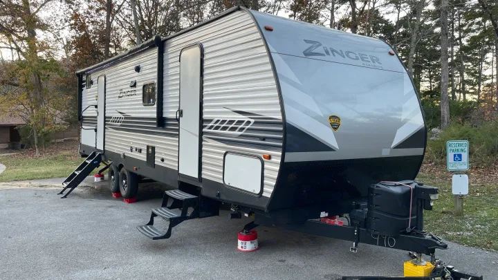 Exterior showing 2 entry doors to the cabin. Exterior has LED lights and speakers. Crossroads RV Zinger 2020