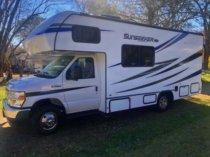 Bright white Class C Sunseeker RV rental parked on grass, ready for adventure and travel.. Forest River Other 2021