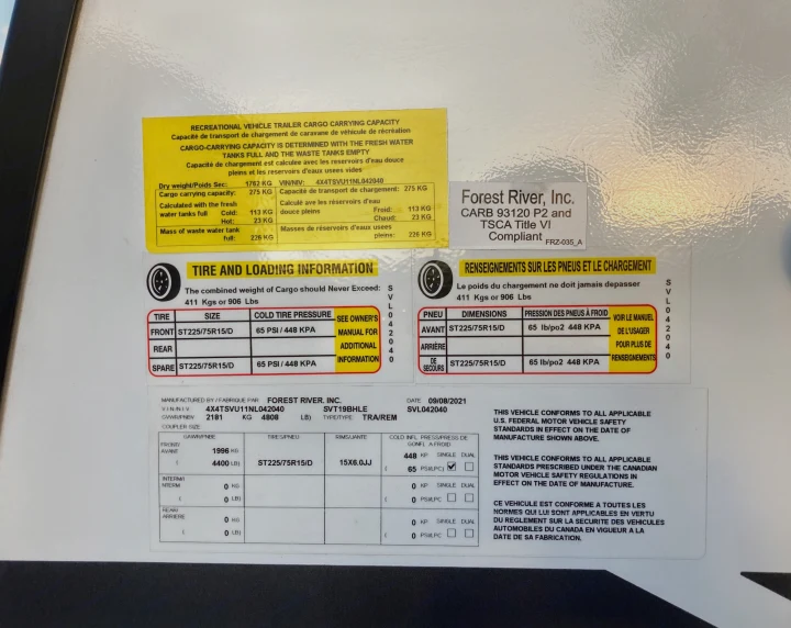 RV rental safety sticker with cargo capacity, tire pressure, and weight details for the recreational vehicle.. Forest River Surveyor Legend 2022