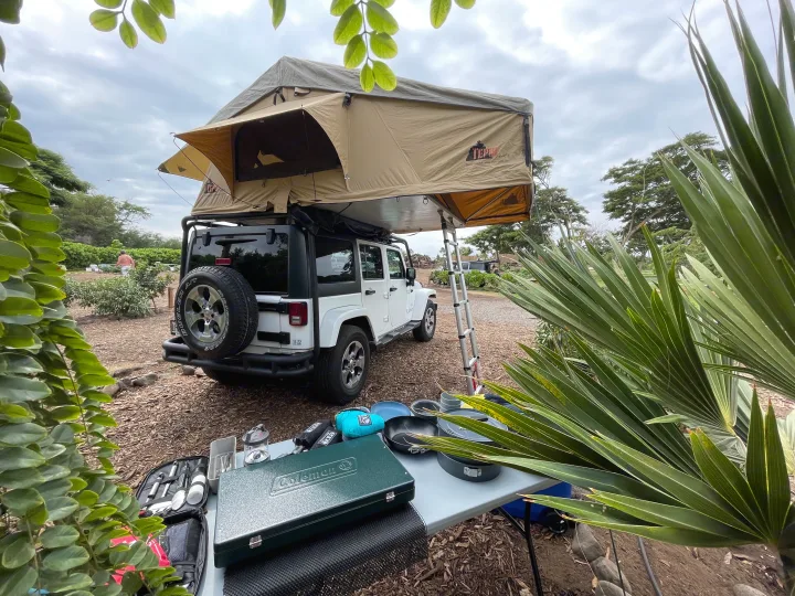 This Jeep with a Tepui rooftop tent offers an RV rental experience for outdoor adventures and camping.. Jeep Wrangler 2017