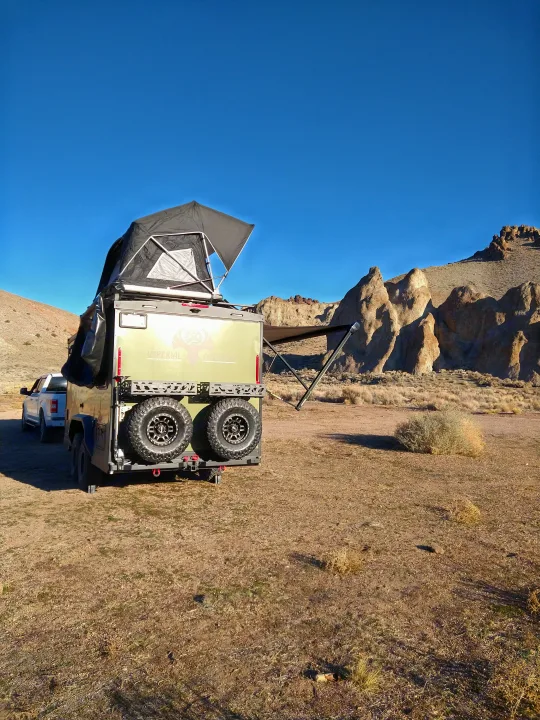 This off-road camper trailer with rooftop tent & awning offers a unique RV rental experience in the desert.. Xplorer X22 2022