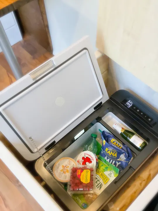 Open portable cooler, packed with berries, cheese, pasta, & bubbly for an RV rental trip. Set to 37°F. Great for road trips!. Other Dodge 2021