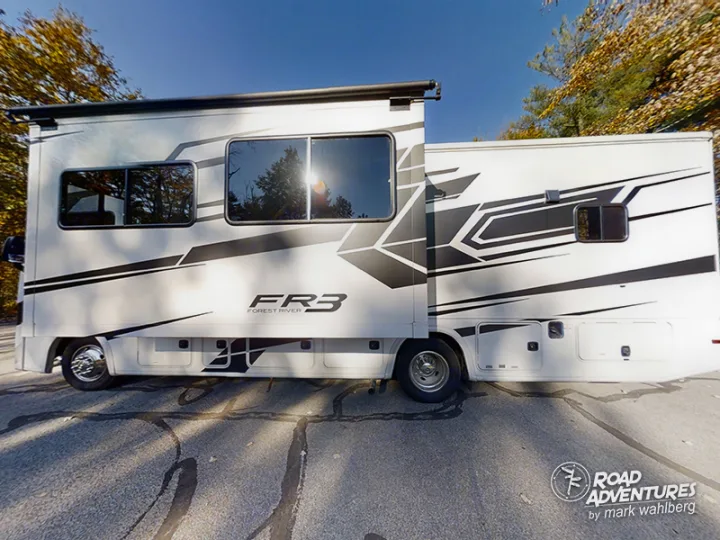 Stylish white Forest River FR3 motorhome RV rental, with a slide-out deployed, for your comfortable outdoor adventure.. Forest River Fr3 2021