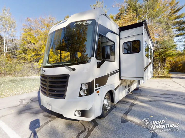 White FR3 motorhome RV rental with slide-out extended, parked in autumn. Ready for your road adventures!. Forest River Fr3 2021