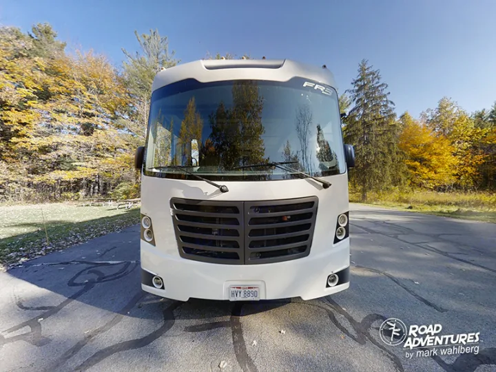White RV rental parked amidst vibrant fall foliage, ready for a scenic road trip adventure.. Forest River Fr3 2021