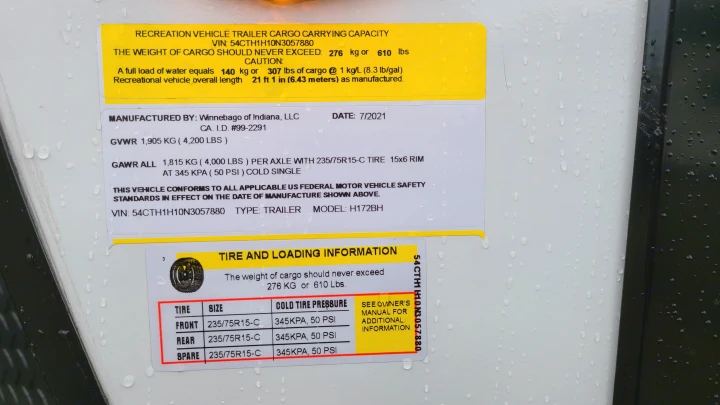 RV rental trailer's compliance label details cargo capacity, VIN, weight ratings, and tire pressure for safe operation.. Winnebago Hike 2022