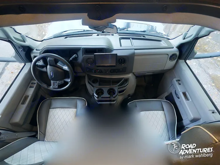 RV rental interior: Ford cab, dashboard, steering wheel, and comfortable quilted driver & passenger seats. Ready for adventures.. Forest River Sunseeker 2022
