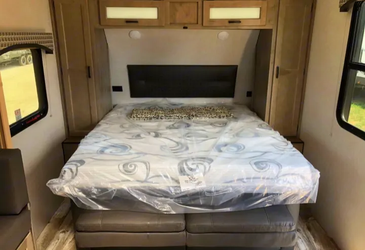 Explore comfort! This RV rental bedroom offers a new bed, storage, and windows, ideal for travel accommodation.. Sonic Sonic Trailer 2025