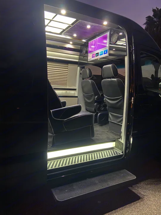 Step inside this luxury RV rental, featuring custom seating, a TV, and mood lighting. Perfect for comfortable travel!. Mercedes-Benz MB140 2015