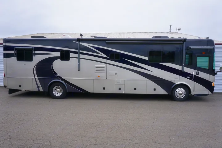 Luxury RV rental: A spacious, dark blue and tan motorhome, perfect for adventures.. Country Coach 40' Inspire 2006