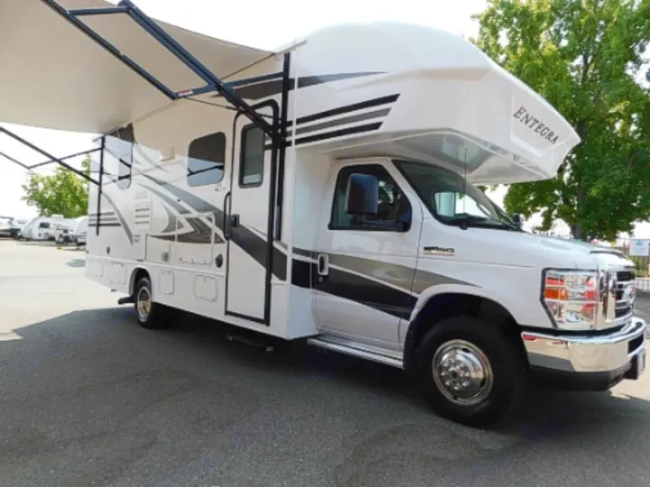 White Entegra Class C RV rental, parked with awning extended, ready for adventure.. Entegra Coach Odyssey 2019