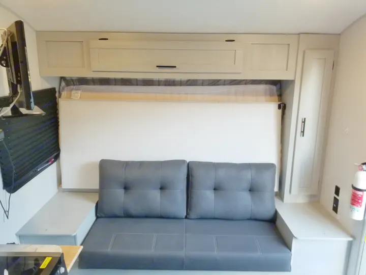 Family couch conversion from the queen mattress with included ottoman. Access to mounted monitor/ television.. Forest River Salem FSX 2021