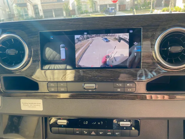 RV rental dashboard: Wide screen displays a 360-degree camera system view for safe parking, with visible controls.. Ultimate Toys Ultimate Coach 2022