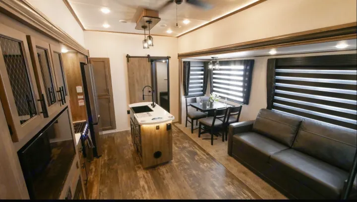 Please note that the shade over the couch was damaged by a renter. The couch is also now a recliner instead of a pull out couch in the living room. Forest River Sabre 2021
