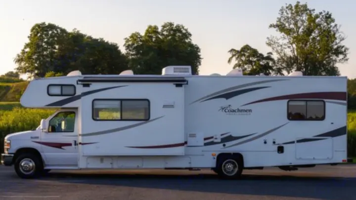 Spacious white Coachmen motorhome RV rental with slide-out & graphics, ready for travel & camping adventures.. Other Freelander 2011
