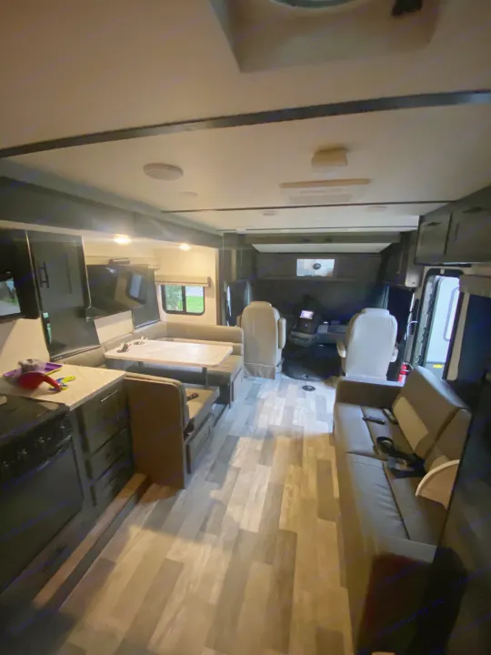 Spacious rv rental interior with a view of the kitchen, living area, and cockpit. Ready for your next adventure!. Forest River Other 2021