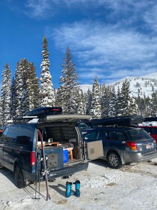Converted van, wagon & ski gear in a snowy mountain parking lot. Ready for an rv rental winter adventure!. Chevrolet Other 2003