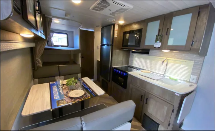 Step inside this rv rental with a modern kitchen, cozy dinette, and bunk beds, perfect for family travel.. Forest River Salem Cruise Lite 2022