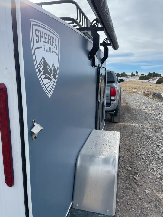 Off-road ready Sherpa trailer with awning & truck. An ideal RV rental for rugged outdoor adventures on dirt roads.. Sherpa trailers Big foot 2022