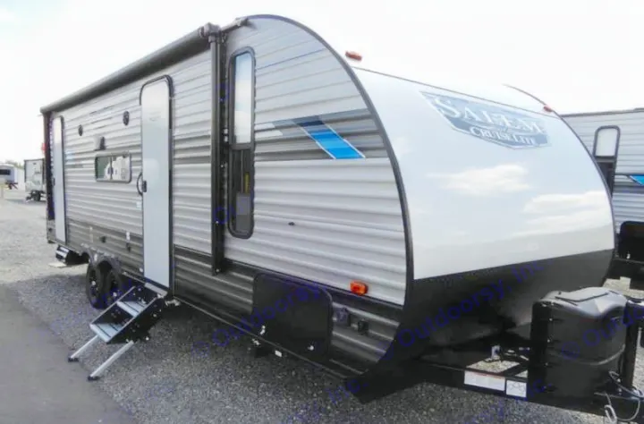 A gray and white Salem Cruise Lite travel trailer, ready for your RV rental adventure and comfortable camping.. Forest River Salem Cruise Lite 2020