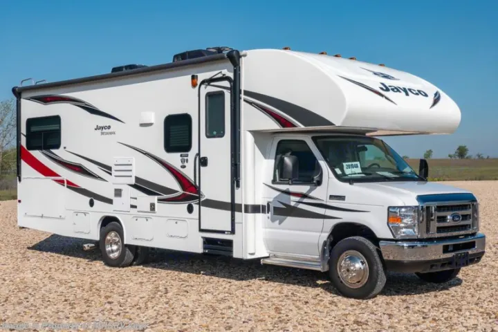 White Jayco Redhawk Class C RV parked on gravel under a blue sky, available for your next rv rental adventure.. Jayco Redhawk 2018