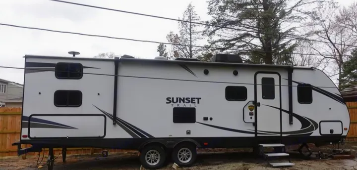 View from entrance. Awning closed. Outdoor mini kitchen. Crossroads RV Sunset Trail Super Lite 2019