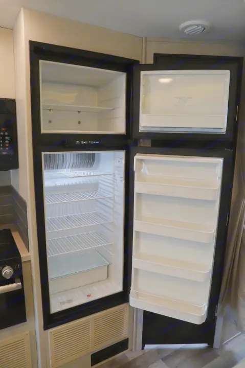 Clean, open RV rental refrigerator and freezer, ready for your adventure.. Entegra 24B 2022