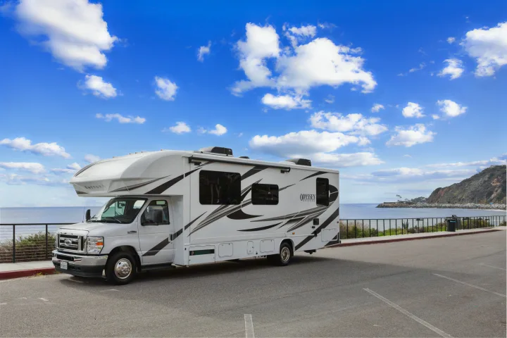 White Entegra Odyssey rv rental parked by the ocean.. Other Other 2022