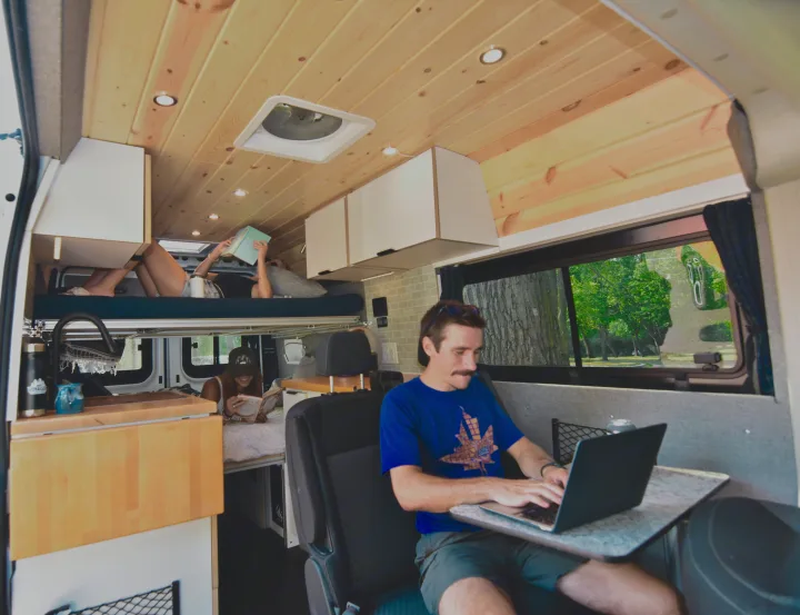 This modern RV rental features cozy bunk beds, a kitchen, and a workspace for digital nomad adventures.. Dodge Dodge Promaster 2500 2021
