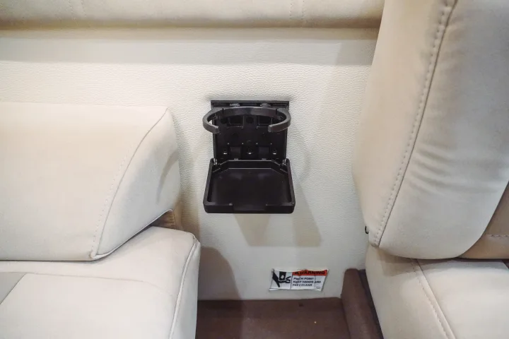 Fold-down cup holder for your RV rental, ensuring drinks stay secure in this practical vehicle interior.. Forest River Coachmen Galleria 2021