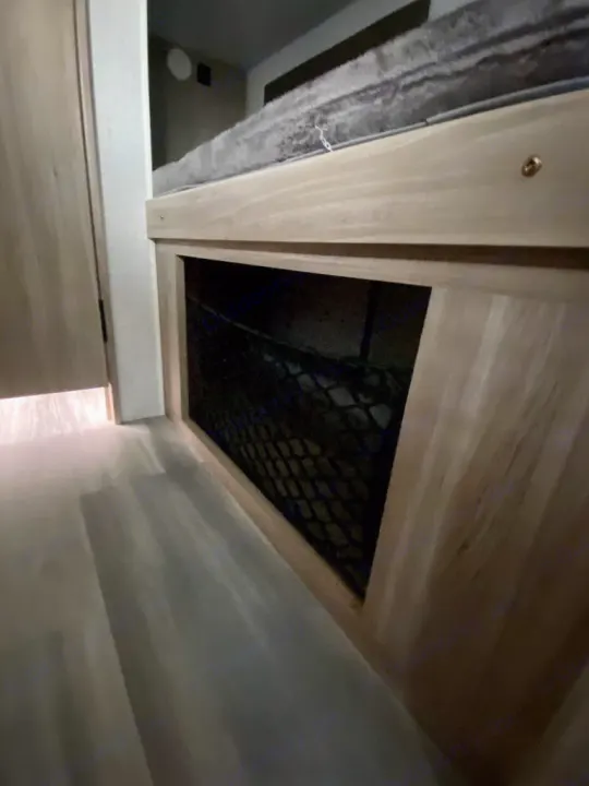 RV rental interior: lower view of a bunk bed with a built-in mesh storage net below.. Winnebago Micro Minnie 1800BH 2022