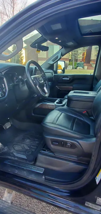 Spacious GMC Denali truck interior, perfect for an RV rental trip.. GMC Sierra 2500HD Denali 2020